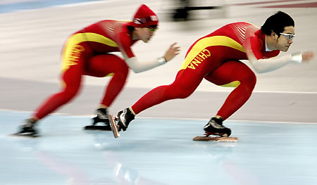 Chinese athletes practice at the Speed Skating venue for the Torino 2006 Winter Olympic Games in Turin, Italy, February 8, 2006. 