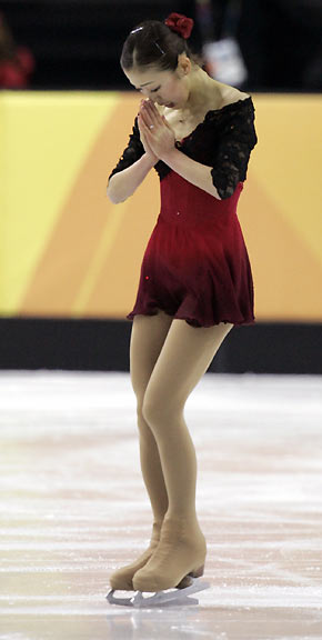 Fumie Suguri from Japan finishes in the women's short program during the Figure Skating competition at the Torino 2006 Winter Olympic Games in Turin, Italy, February 21, 2006. [Reuters]