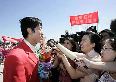 Chinese athletes return home