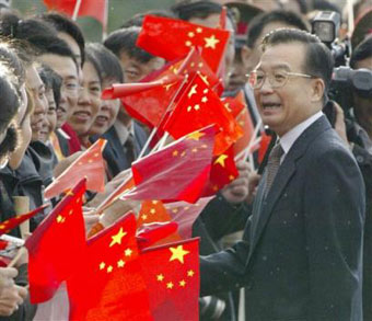 Chinese Premier Wen Jiabao speaks with his fellow countrymen shortly after his arrival in Moscow, Thursday, Sept. 23, 2004. 