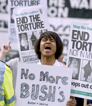 Protesters greet Bush senior in London