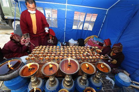 Monks pray for quake victims