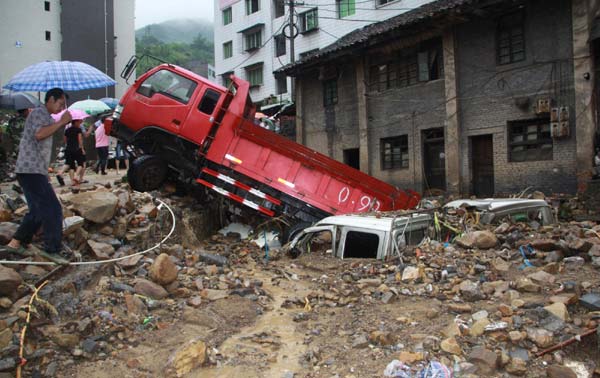 Floods leave 13 dead, 23 missing in SW China