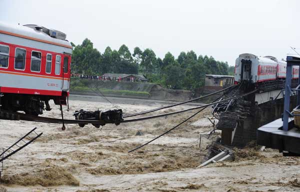 Train cars fall into river in SW China, no injuries