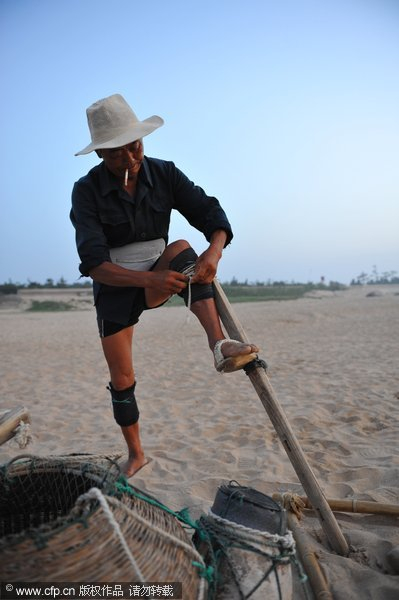 Fisherman stilted against power of the sea