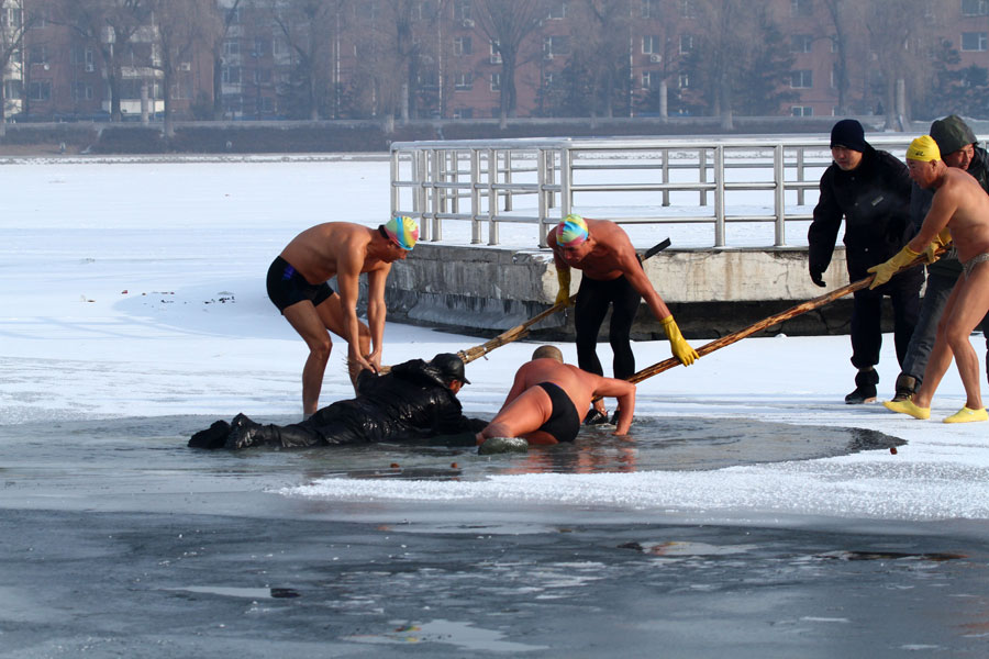 Man saved after falling through frozen lake