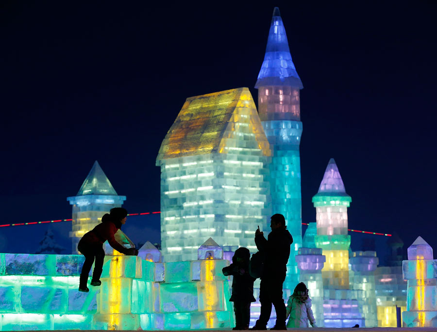 Ice sculptures shine at night in Harbin