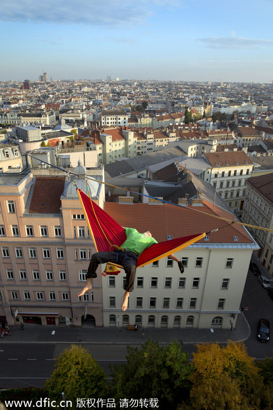 Thrill seeker enjoys hammock in the sky