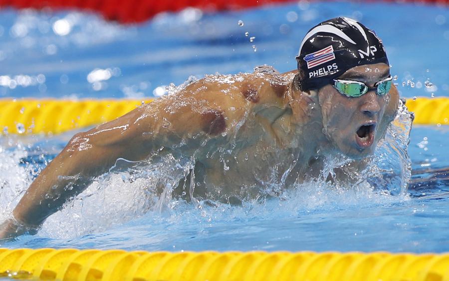 Phelps adds Olympic gold medal haul to historic 21