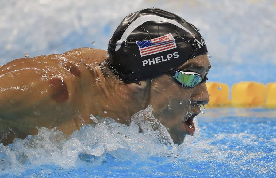 Phelps adds Olympic gold medal haul to historic 21