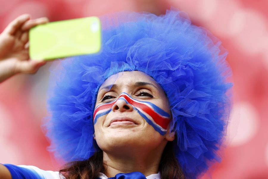 National flags on fan's face