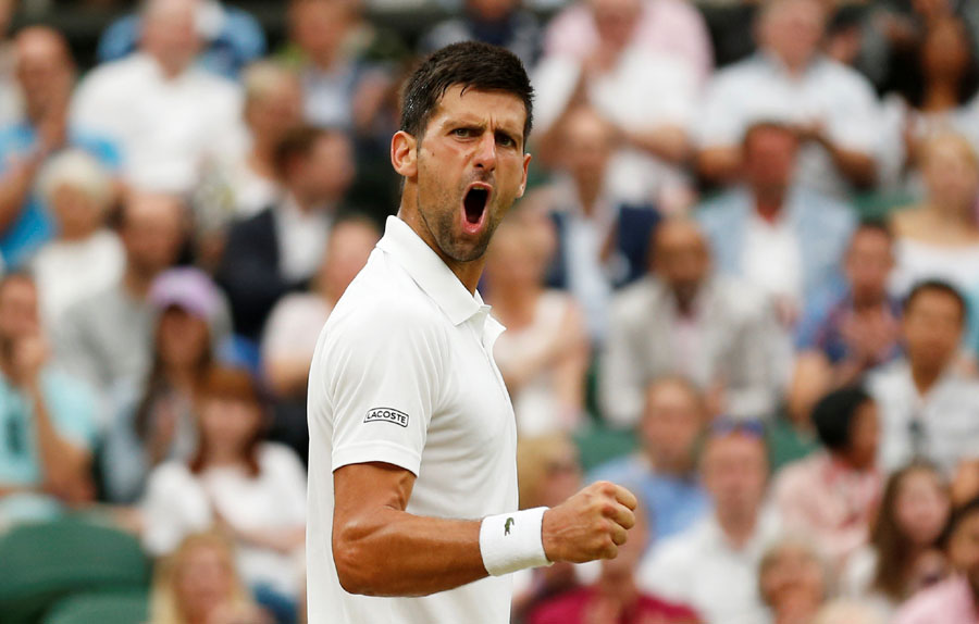 Djokovic hits out over delay after booking place in quarters