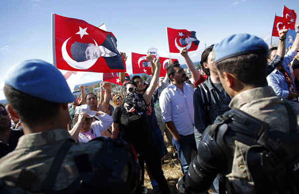 Turkish police clash with protesters over coup trial