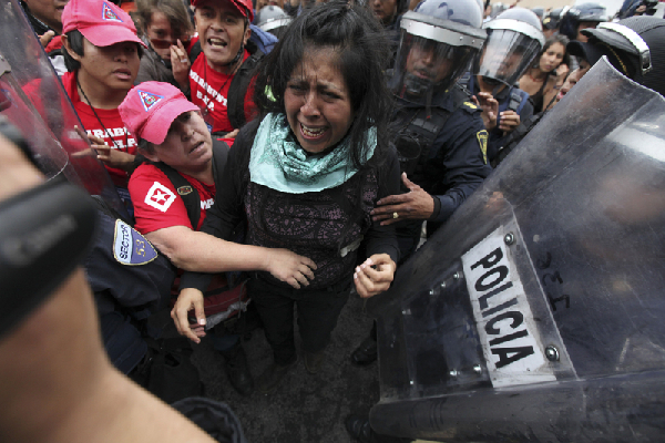 Protesters, police clash in Mexico before marches