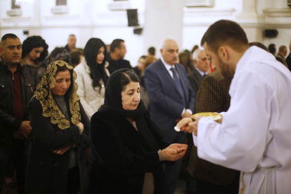 Baghdad's Christians gather defiantly for Christmas Eve mass