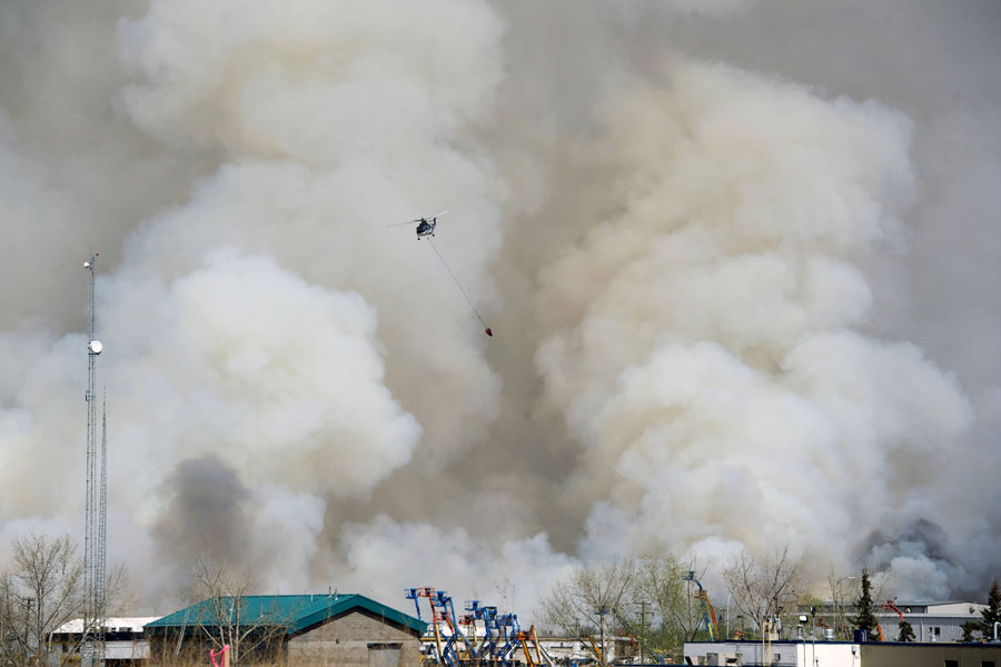 Raging wildfire spreads to more areas in west Canada