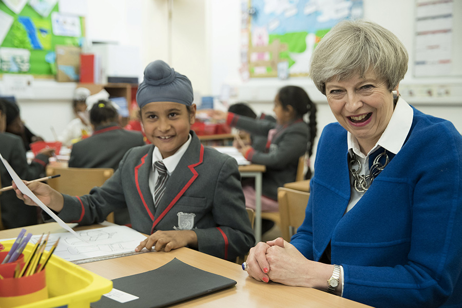 Britain's PM May meets pupils of primary school in Birmingham