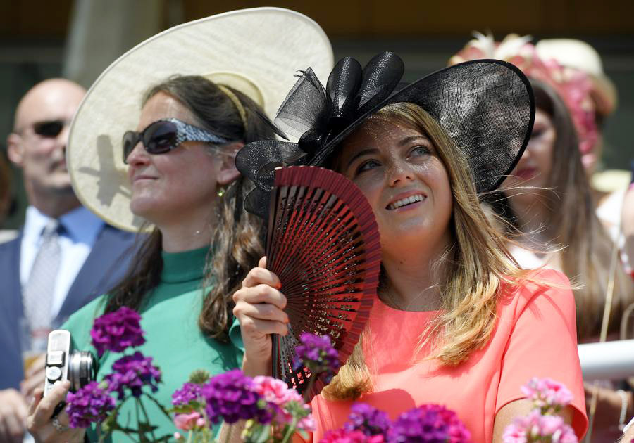 Despite high temps, Royal Ascot-goers don finest outfits