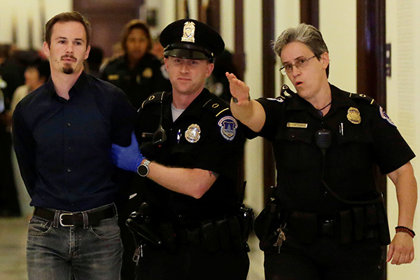 Police arrest 80 as protesters storm US Capitol over healthcare reform