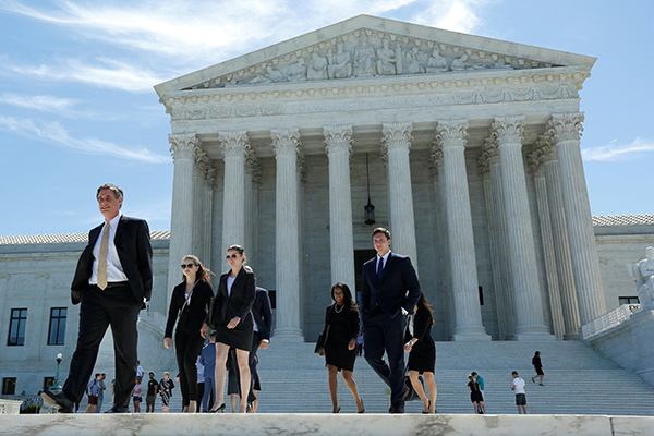 US top court rejects Trump bid to include grandparents in travel ban