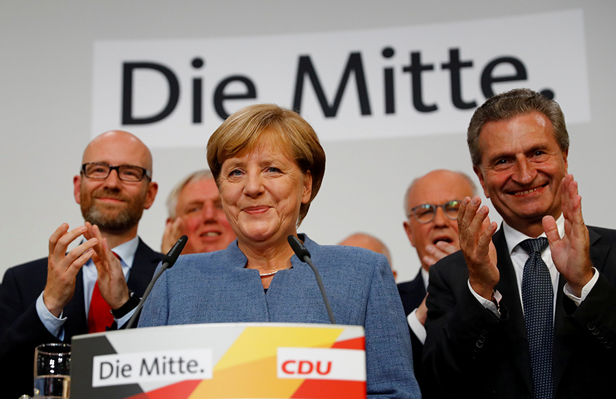 Merkel wins 4th term but nationalists surge in German vote